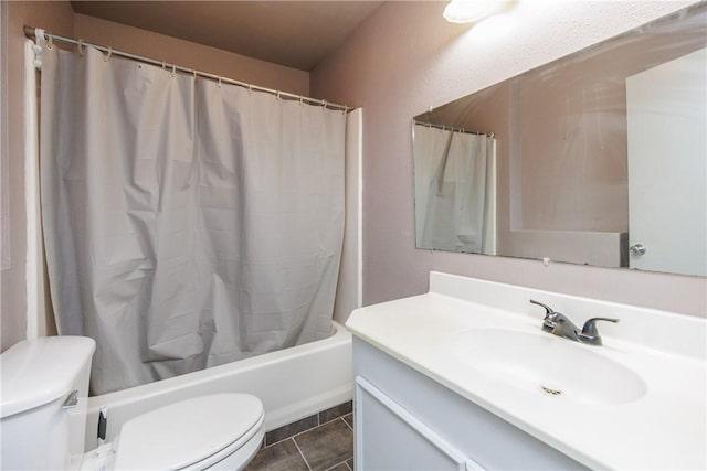 full bathroom with toilet, vanity, tile patterned flooring, and shower / tub combo