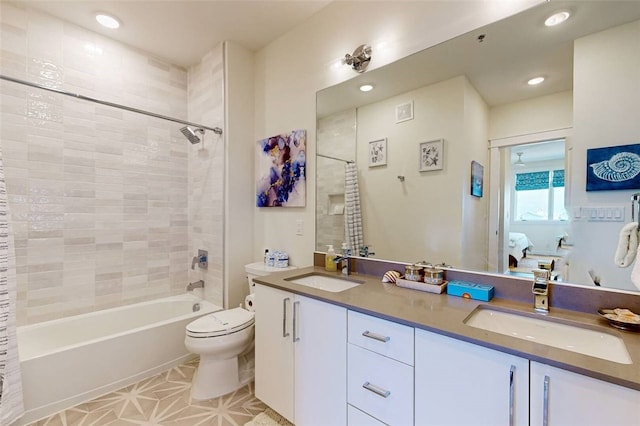 full bathroom with toilet, shower / bath combo, vanity, and tile patterned flooring