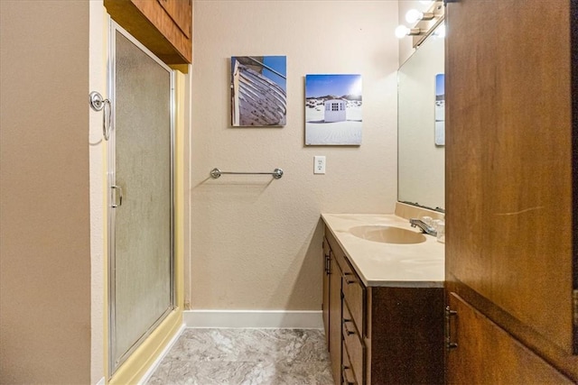 bathroom featuring vanity and an enclosed shower