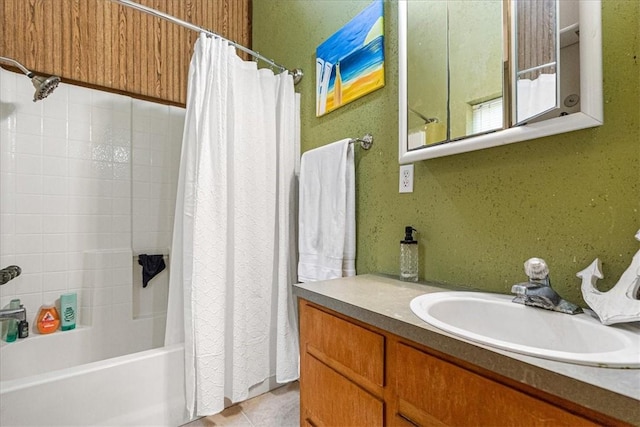 bathroom with tile patterned flooring, vanity, and shower / tub combo