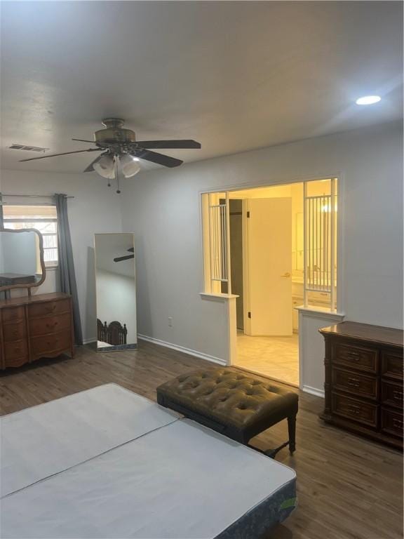 3023 66th St, Lubbock, TX 79413 - bedroom with wood finished floors, baseboards, a ceiling fan, and recessed lighting