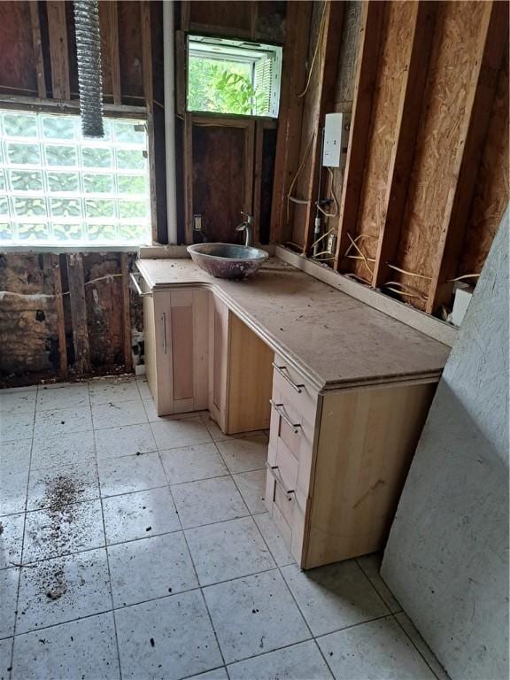 bathroom featuring tile patterned flooring and vanity