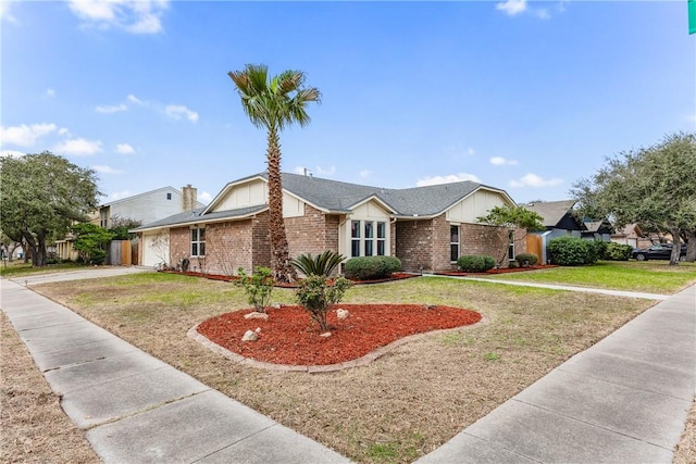 ranch-style home with a front lawn and a garage