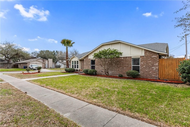 ranch-style house featuring a front lawn