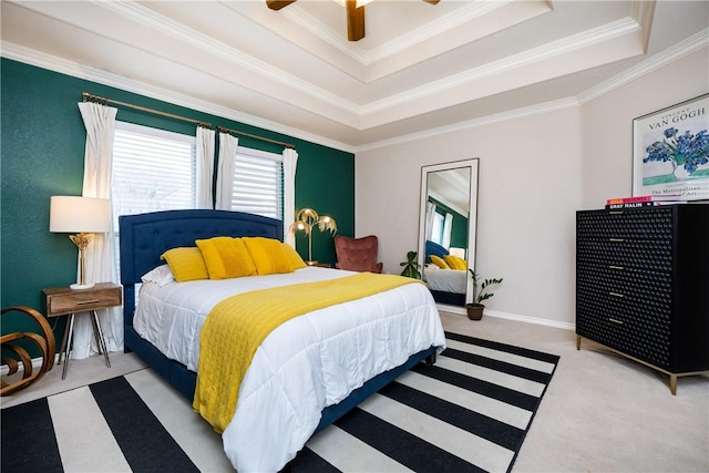 bedroom with a raised ceiling, ceiling fan, crown molding, and light carpet