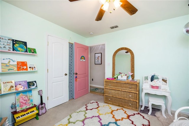 carpeted bedroom with ceiling fan