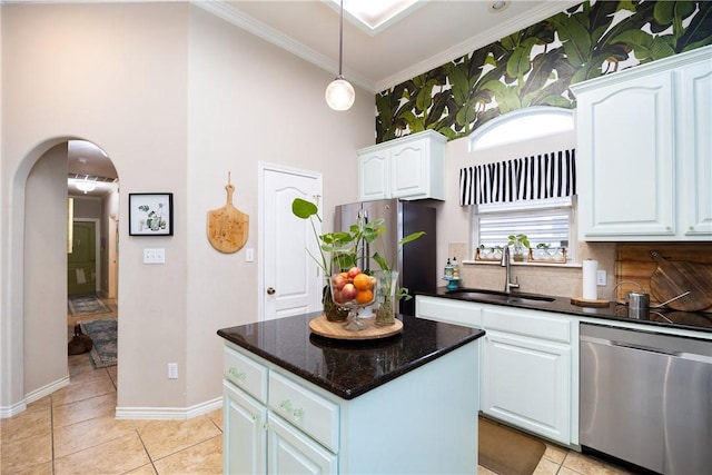 kitchen with white cabinets, stainless steel appliances, light tile patterned flooring, and sink