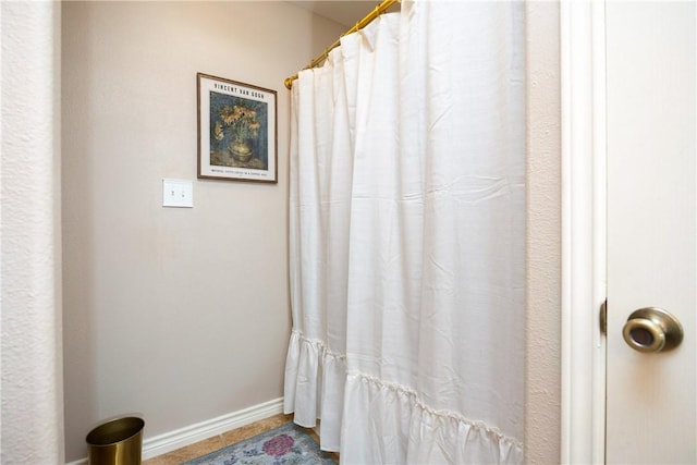 bathroom with tile patterned floors