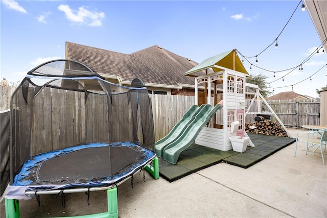 view of jungle gym with a trampoline