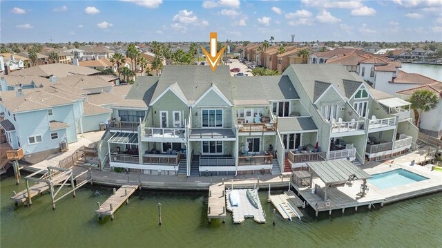 bird's eye view with a residential view and a water view