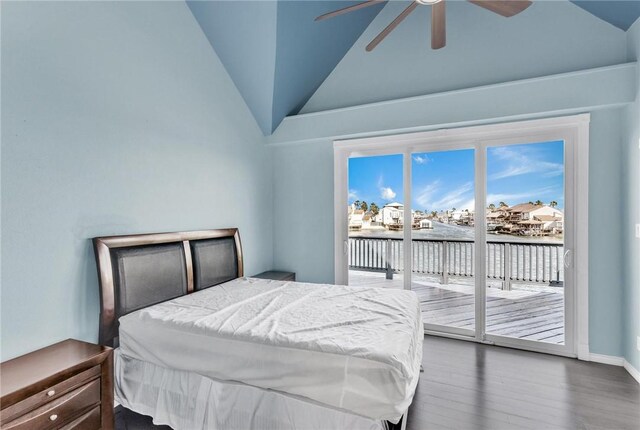 bedroom with baseboards, vaulted ceiling, wood finished floors, a ceiling fan, and access to outside