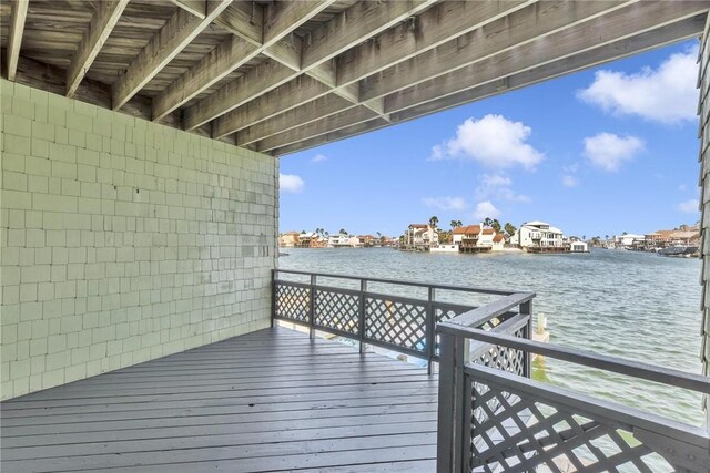 wooden deck featuring a water view