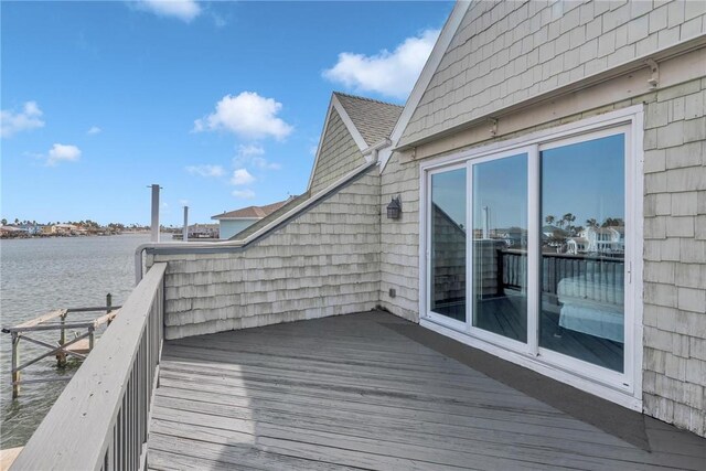 wooden terrace with a water view