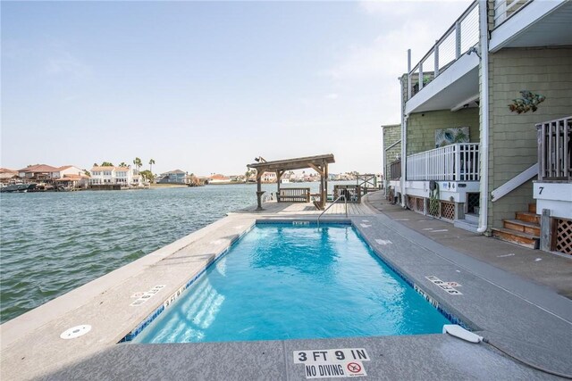 community pool featuring a water view