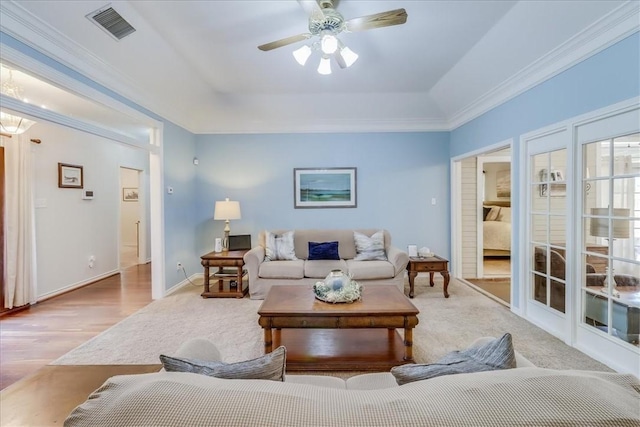7430 Bourget Dr, Corpus Christi, TX 78413 - living room featuring a ceiling fan, ornamental molding, a raised ceiling, and wood finished floors