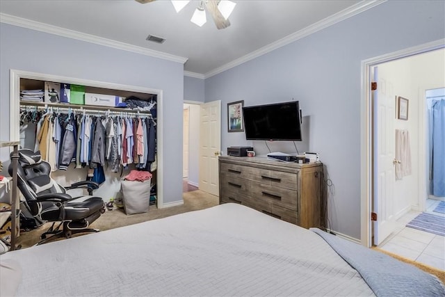 7430 Bourget Dr, Corpus Christi, TX 78413 - bedroom with ornamental molding, a closet, ceiling fan, carpet floors, and ensuite bath