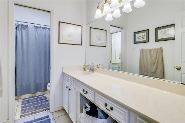 7430 Bourget Dr, Corpus Christi, TX 78413 - full bath featuring vanity, tile patterned floors, curtained shower, and a chandelier