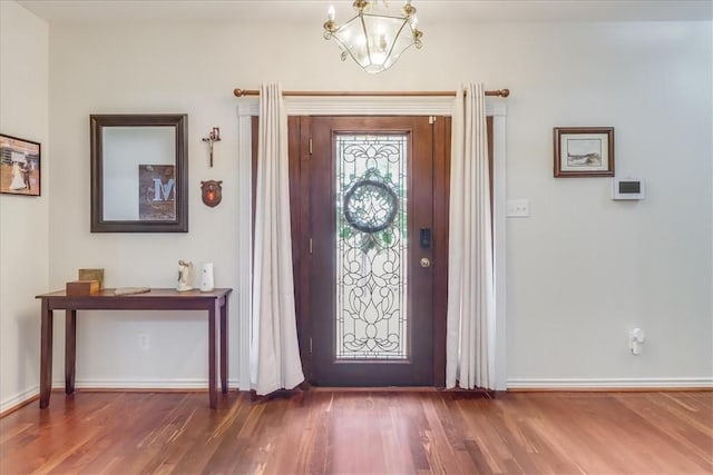7430 Bourget Dr, Corpus Christi, TX 78413 - entrance foyer with wood finished floors and a chandelier