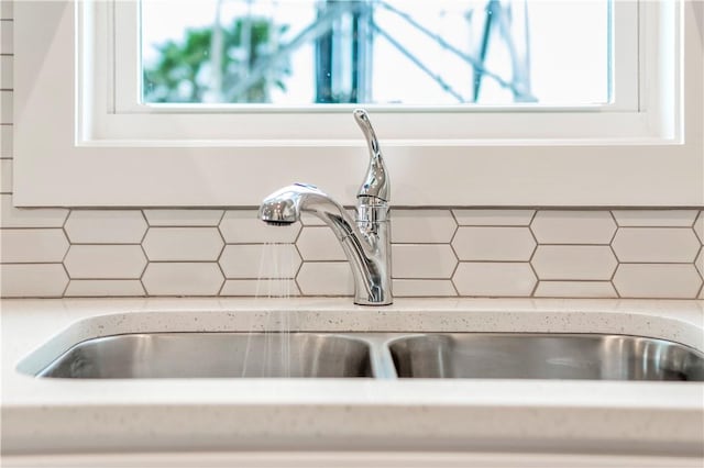 room details with backsplash and a sink