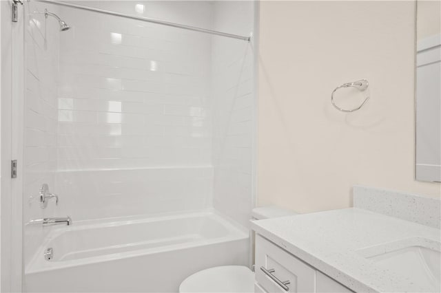 bathroom with vanity, toilet, and shower / bathtub combination