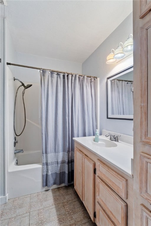 bathroom featuring vanity and shower / bathtub combination with curtain