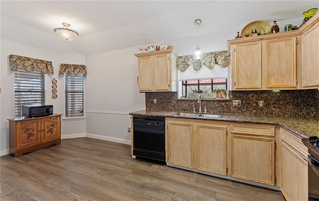 kitchen with wood finished floors, a sink, light brown cabinetry, black appliances, and tasteful backsplash