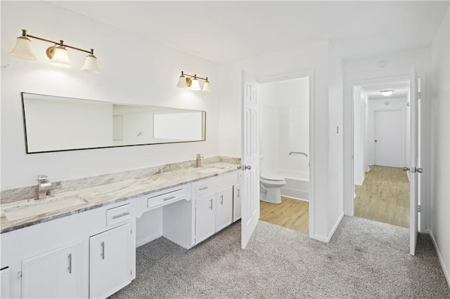 full bathroom featuring toilet, vanity, and shower / bathing tub combination