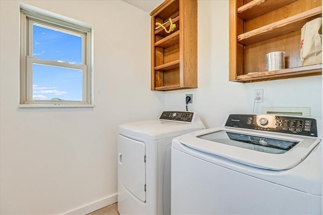 236 Dolphin Ln, Port Aransas, TX 78373 - laundry area with washer and dryer and baseboards
