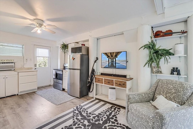 236 Dolphin Ln, Port Aransas, TX 78373 - living area featuring light wood-style flooring and a ceiling fan
