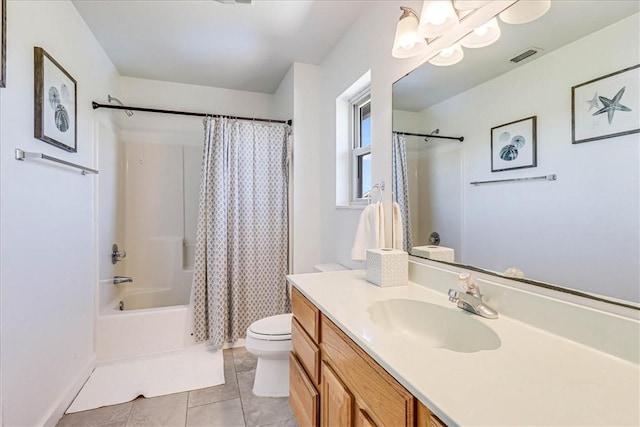 236 Dolphin Ln, Port Aransas, TX 78373 - full bathroom featuring toilet, tile patterned floors, a chandelier, vanity, and shower / bath combo