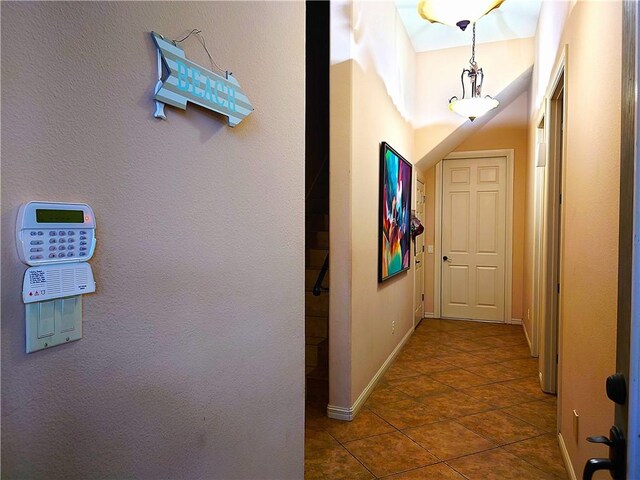 corridor with tile patterned flooring