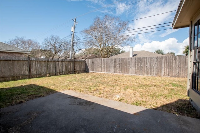 view of yard featuring a patio area and a fenced backyard