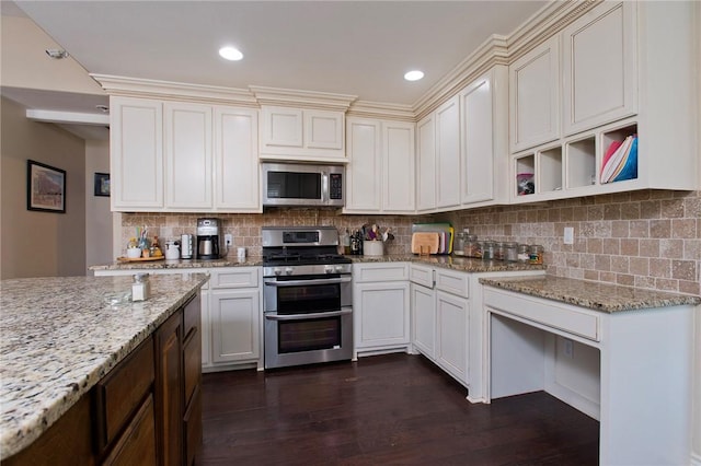 422 Poenisch Dr, Corpus Christi, TX 78412 - kitchen with appliances with stainless steel finishes, dark wood-style floors, decorative backsplash, light stone countertops, and recessed lighting