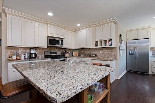 422 Poenisch Dr, Corpus Christi, TX 78412 - kitchen featuring stainless steel appliances, open shelves, dark wood finished floors, light stone countertops, and tasteful backsplash