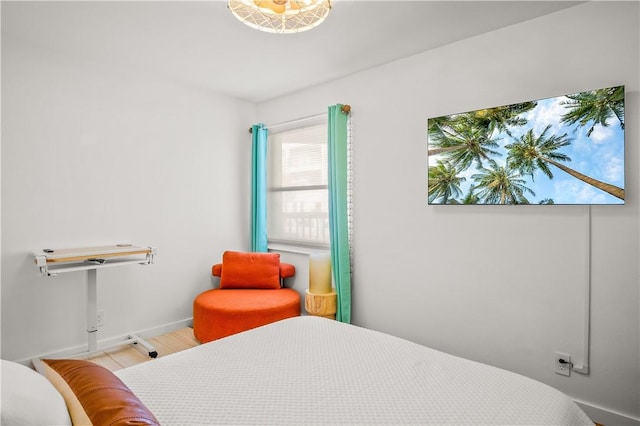 bedroom featuring baseboards