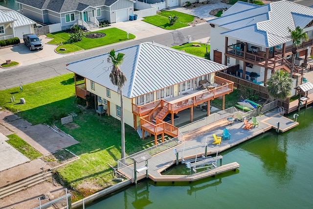 bird's eye view with a residential view and a water view