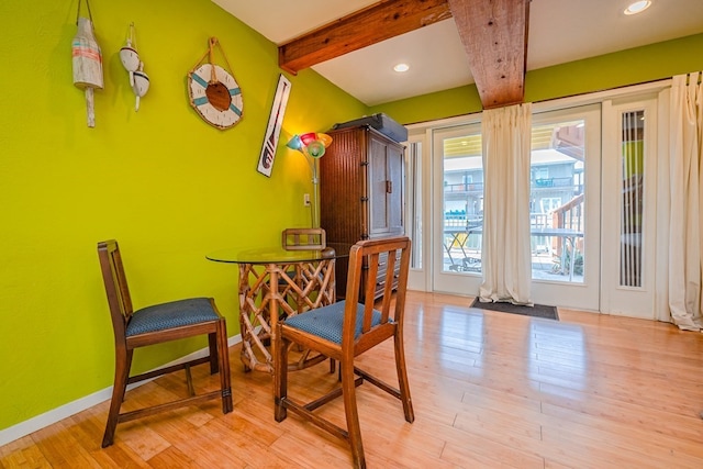 dining space with recessed lighting, beamed ceiling, baseboards, and wood finished floors