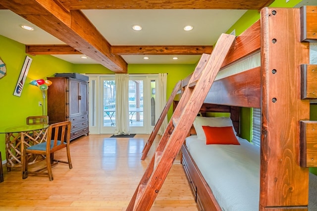 bedroom featuring light wood-style flooring, beam ceiling, and recessed lighting