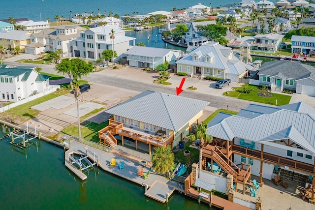 bird's eye view featuring a water view and a residential view