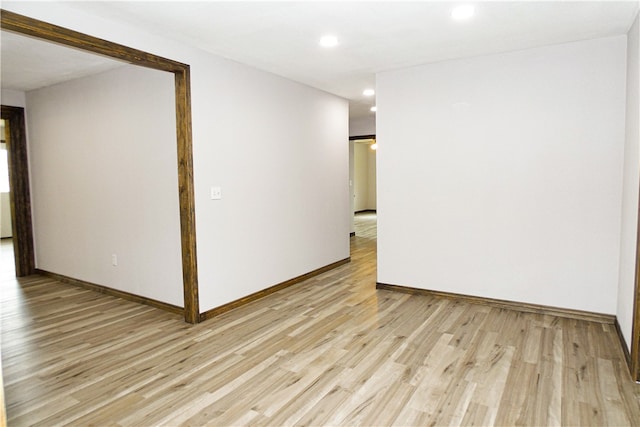 empty room with light hardwood / wood-style floors