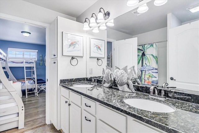 bathroom featuring hardwood / wood-style floors and vanity