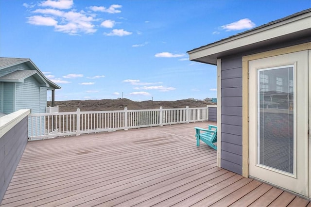 wooden deck with a mountain view