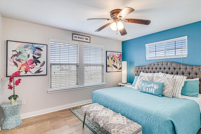 bedroom featuring light wood-type flooring and ceiling fan