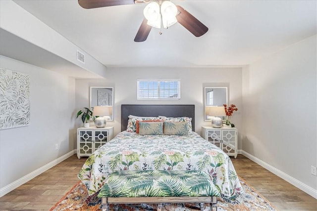 bedroom with ceiling fan and wood-type flooring