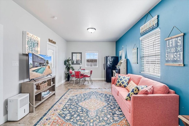 living room featuring plenty of natural light