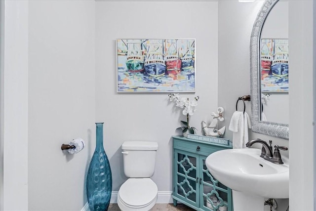 bathroom featuring sink and toilet