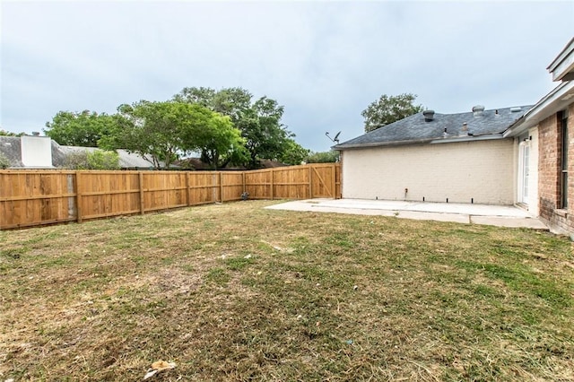 view of yard featuring a fenced backyard and a patio