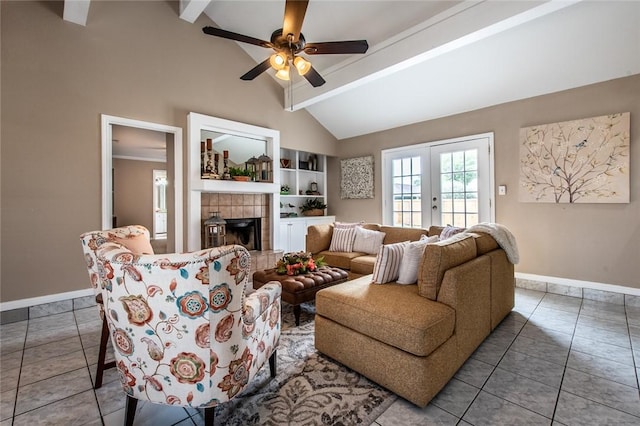 living area featuring beam ceiling, baseboards, and tile patterned flooring
