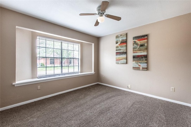 unfurnished room featuring baseboards, carpet floors, and ceiling fan