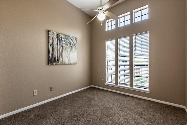 unfurnished room featuring baseboards, carpet, and ceiling fan
